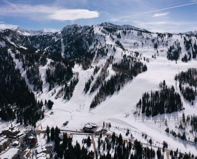 A view of Solitude mountain with snow, showing the trails