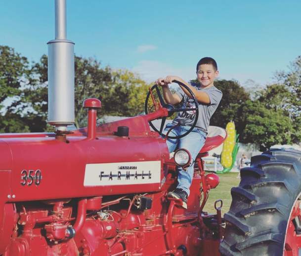 Rottkamp Brothers Farm boy on a tractor