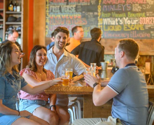 Group of young adults drinking at a brewery