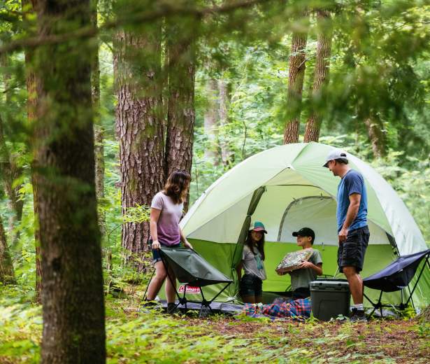 Family camping outdoors