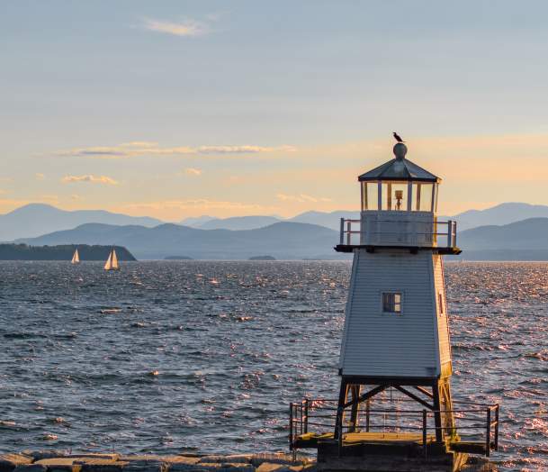 An image looking west over Lake Champlain and the Burlington Breakwater - Lighthouse