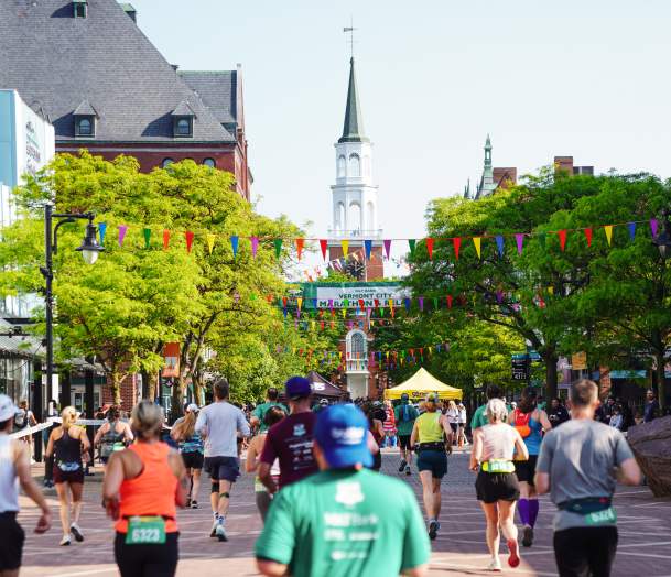 The Vermont City Marathon runners head up Church Street