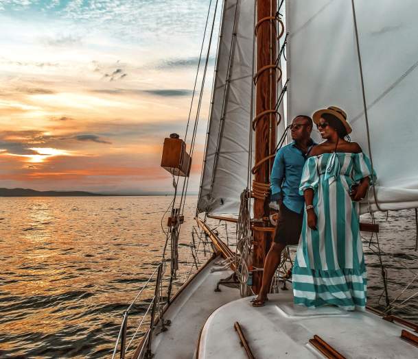 couple enjoys sunset on schooner on Lake Champlain
