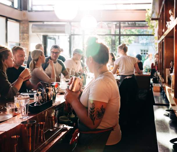 bar tender serving drinks and winter dining in Burlington Vermont