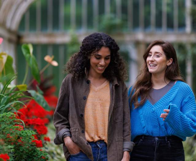 Two girls walking through the Tropical Ravine at Botanic Gardens.