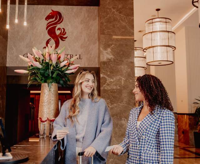 spring-24-grand-central-2-females-checking-in