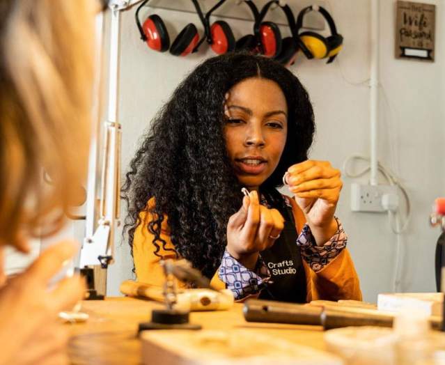 Lady enjoying jewellery making at Gobbins Crafts