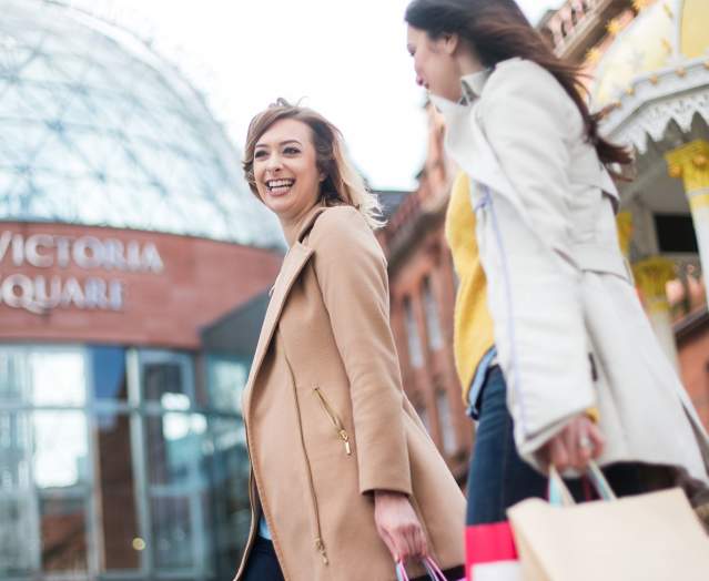 ladies shopping in Belfast, outside Victoria Square Shopping Centre.