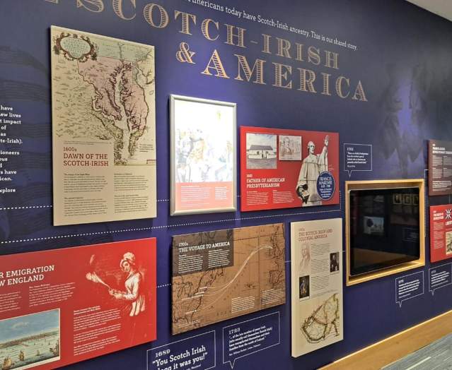 Informative exhibit wall showcasing the history of Ulster-Scots/Scotch-Irish in America. The information features maps, text panels and images