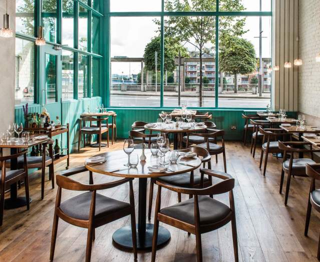 Interior dining tables and chairs at OX, Beflast