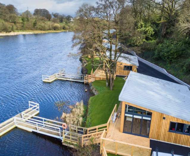 Killyhevlin lakeside lodges on a beautiful sunny day with blue skies above