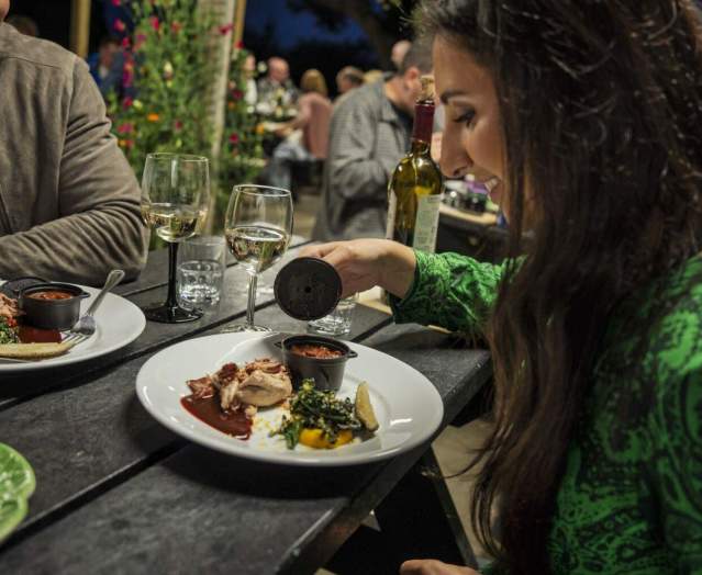 Couple enjoying a meal and a glass of wine at Slemish Supper Club, Ballymena