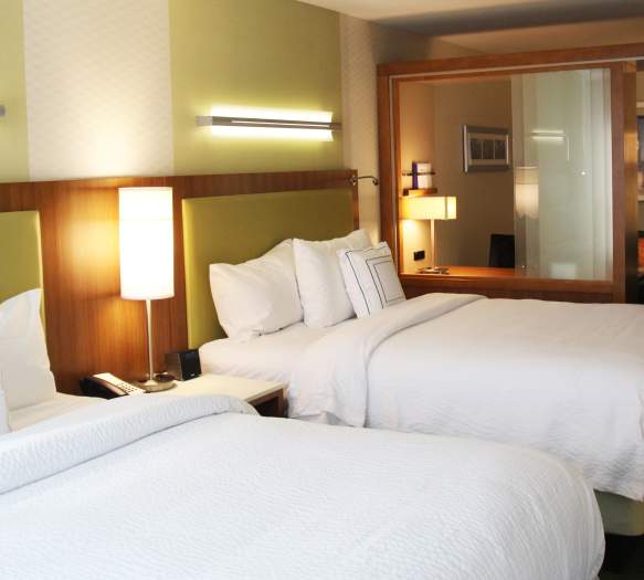 Two-queen hotel room in Bloomington