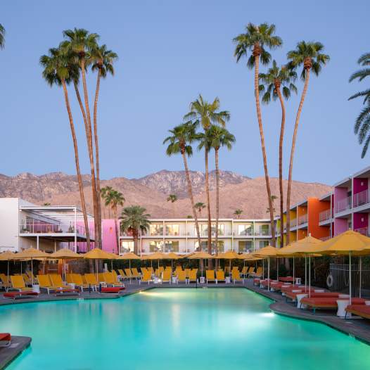 The pool area with the San Jacinto Mountains in the background at The Saguaro in Palm Springs