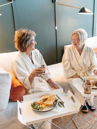 Two women relax at Pavitra Spa while having lunch