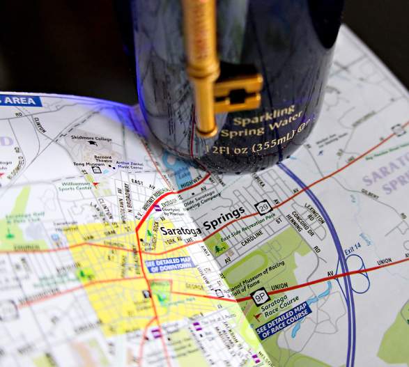 Map of Saratoga Springs with bottle of Saratoga Water