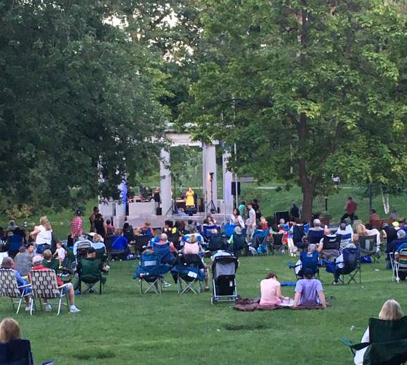 People enjoying a concert in congress park