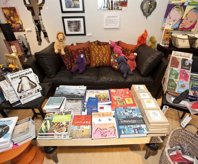 Books, games, artwork and a seating area in a Providence RI store