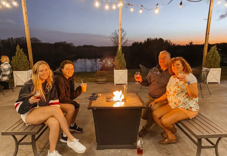 A group four enjoying wine on the patio firepit at Sycamore Winery, Terre Haute, Indiana