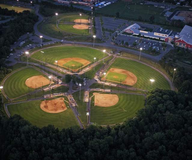 Illuminated baseball fields at Claude Moore complex in Sterling, Virginia, lit for evening play