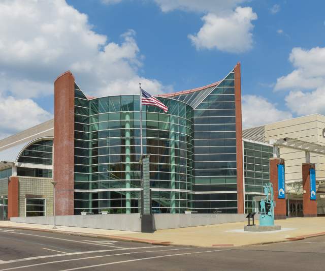 John S. Knight Center convention venue in downtown Akron, Ohio, featuring a modern glass atrium entrance, event facilities, and contemporary architecture.