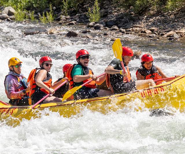 Group of people rafting at a river