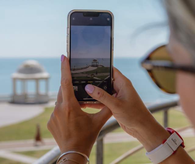 Taking a photo of the seafront from de la warr pavilion