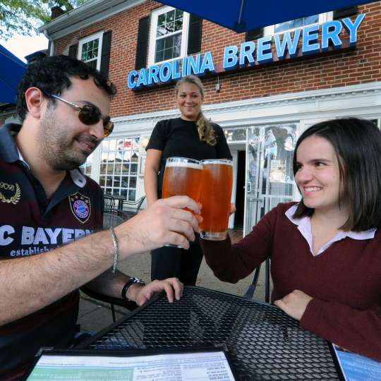 Carolina Brewery Eduardo and Liliana Carvi (patrons) Kristina Healy (server).JPG