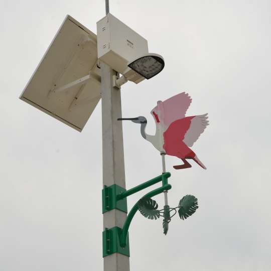 Image of artwork, pink flamingo wind vane