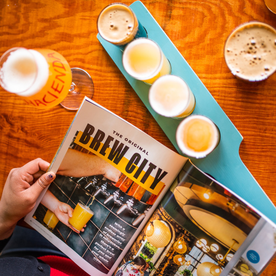 brew city page from official visitor's guide with beer flight