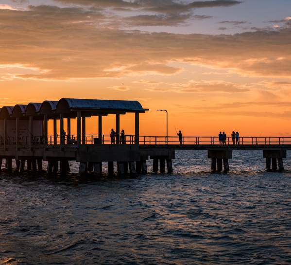 The sun sets behind the popular Jekyll Island Fishing Pier