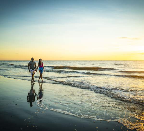 Couple walking on East Beach