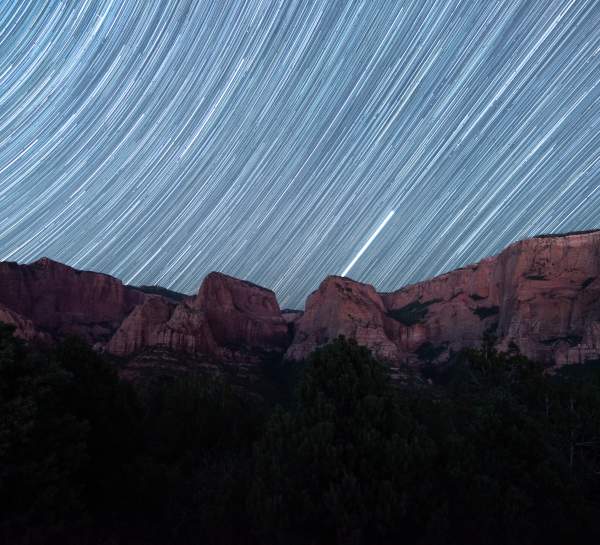 Dark sky views in Kolob Canyons above the vibrant red rock cliffs.