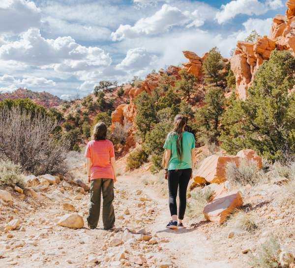 2 people hiking thors hideout trail in the spring