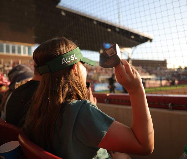 A close up of a woman's AUSL visor