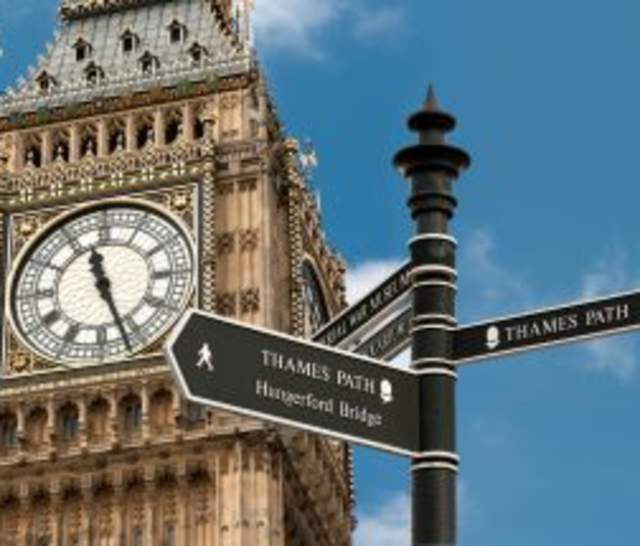 Signpost showing Thames Path in front of Big Ben