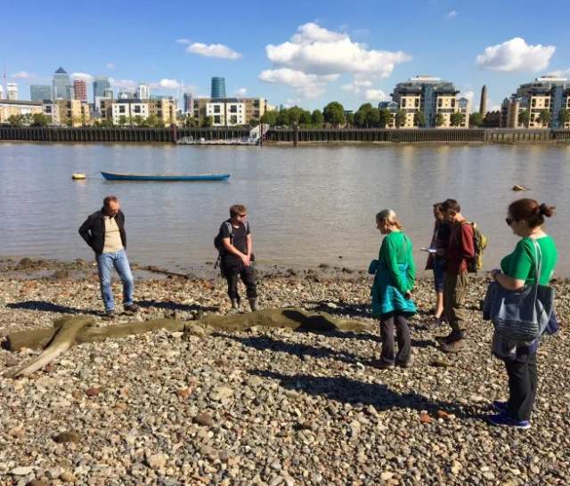 People looking at the beach on Deptford Foreshore