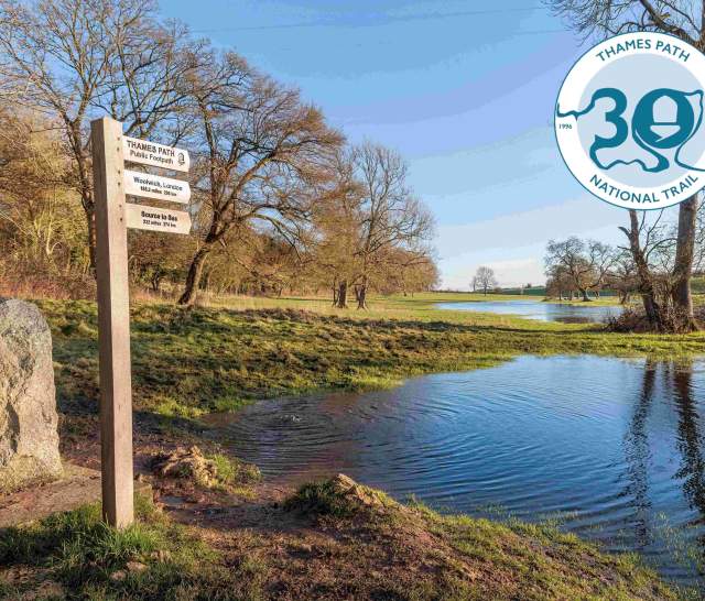 View of the source of the Thames and signpost for Thames Path