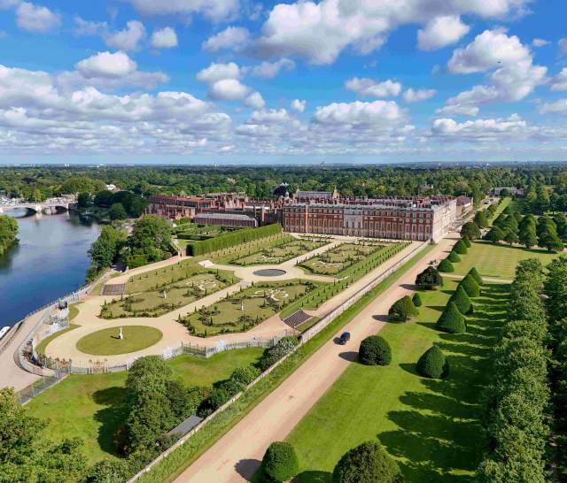 View of Hampton Court, gardens and the river Thames