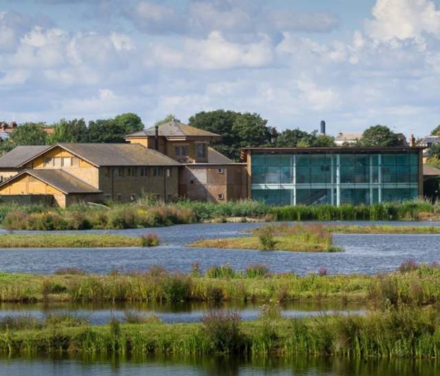 view across reservoir of WWT London Wetland Centre Visitor Centre