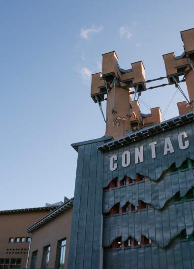 External view of Contact Theatre with CONTACT sign