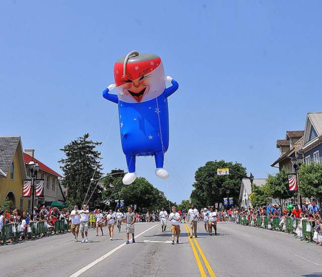 Red, white and blue firecracker parade inflatable in Dublin, Ohio 4th of July Parade