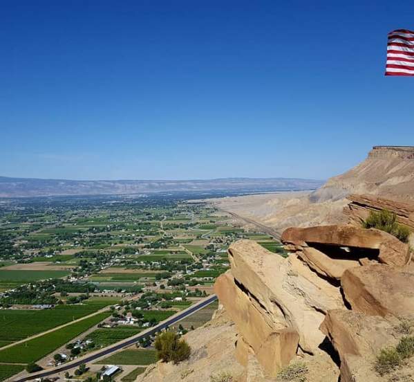 American Flag Waving Above the Grand Junction Area on the Book Cliffs