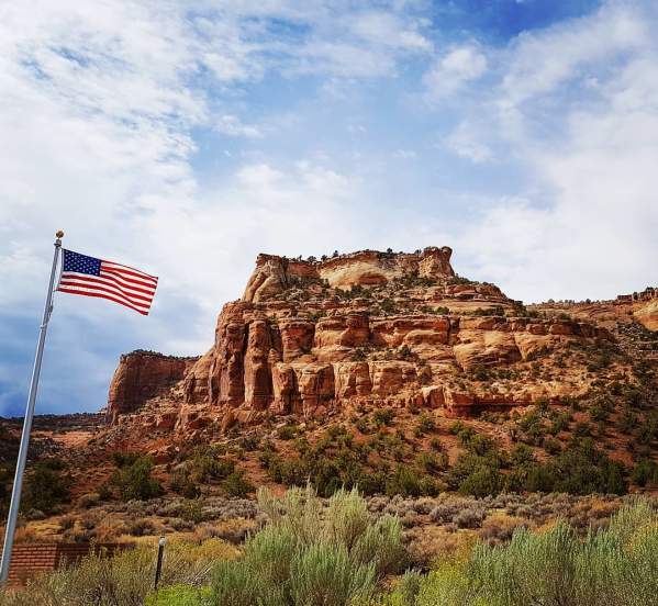 American Flag in front of Red Rocks