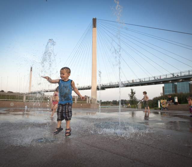 Children Playing in Splash Area at Base of Bob the Bridge