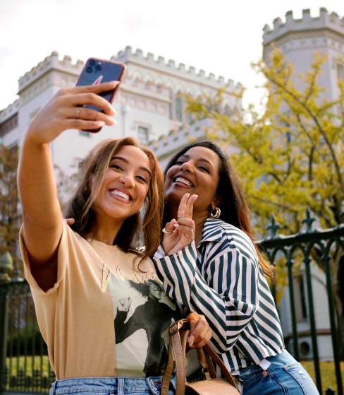 Women taking selfie in front of Old State Capitol