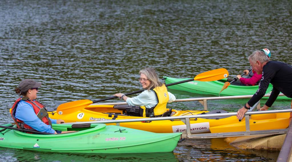 A person launching an accessible kayak at Morgan Falls Overlook Park