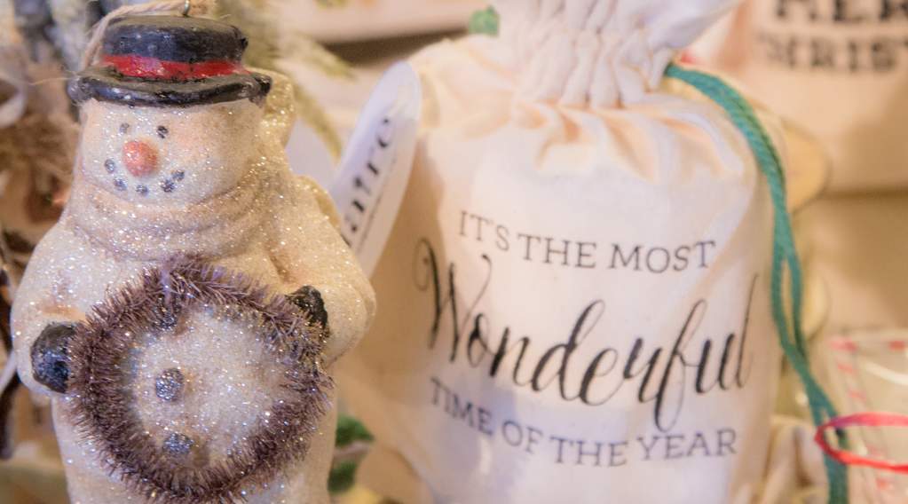 A snowman figurine and other holiday decor