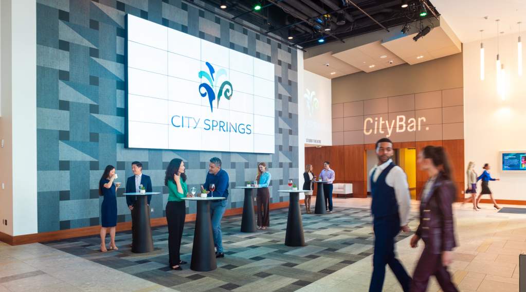 Group of People in the Studio Theatre lobby at City Springs