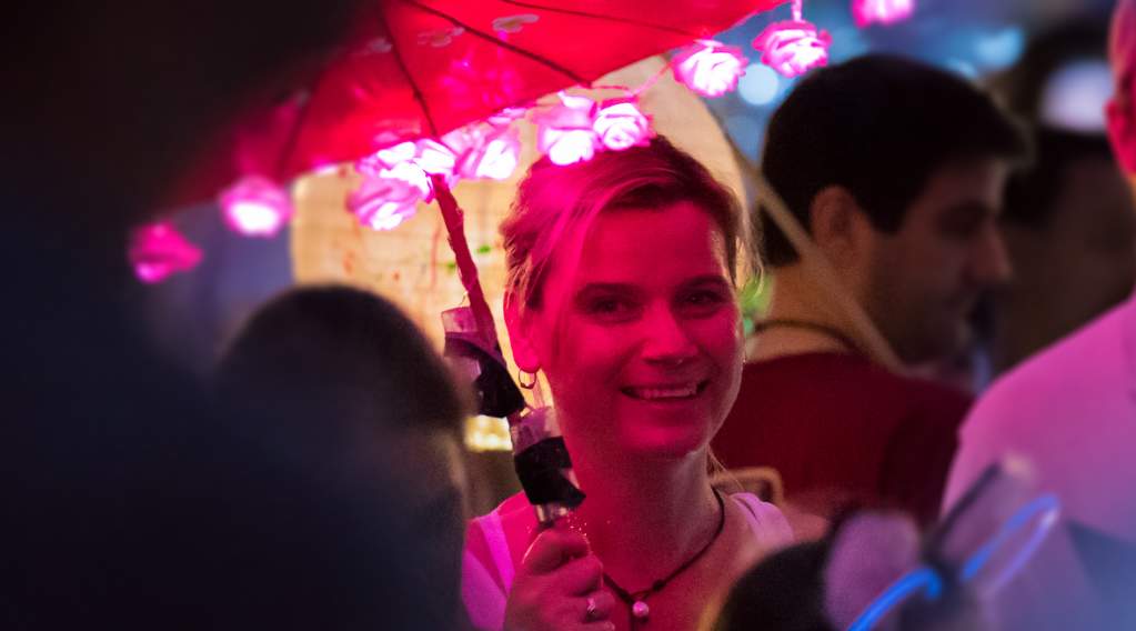Woman holding an umbrella lantern at the annual Sandy Springs Lantern Parade